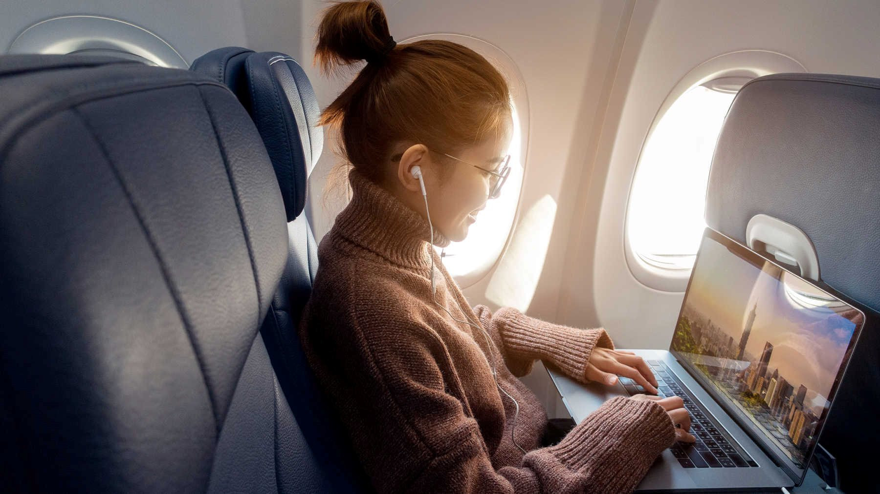 woman-laptop-plane.jpg