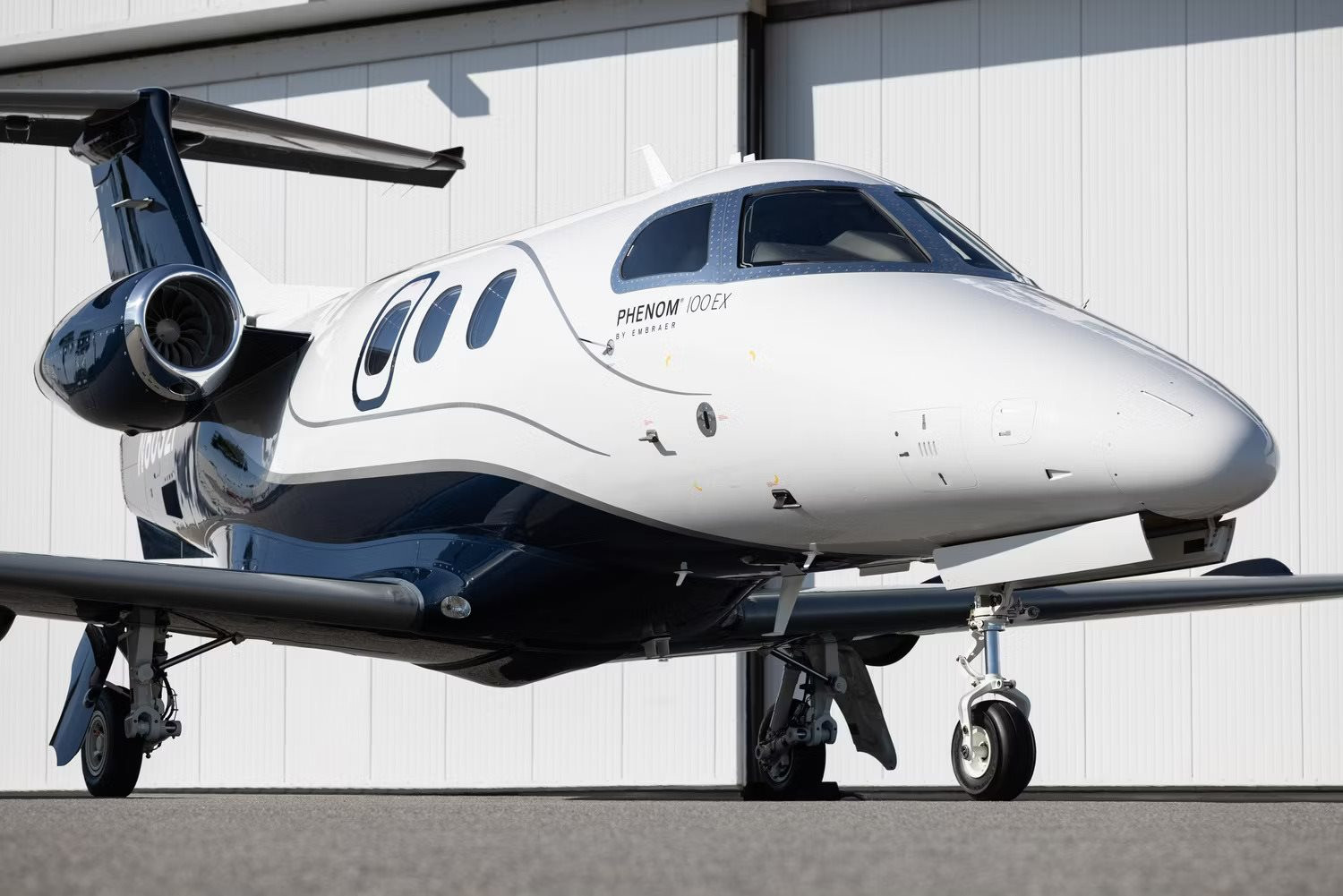 embraer-phenom-100ex-parked-outside-a-hangar.jpg