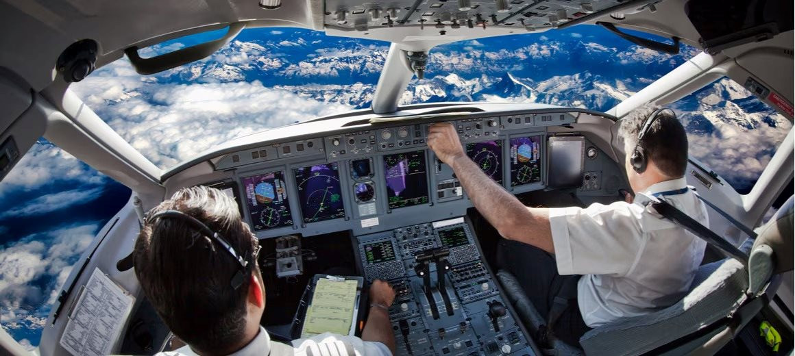 inside-view-of-pilots-at-the-controls-of-a-large-plane-full-width_11zon.jpg