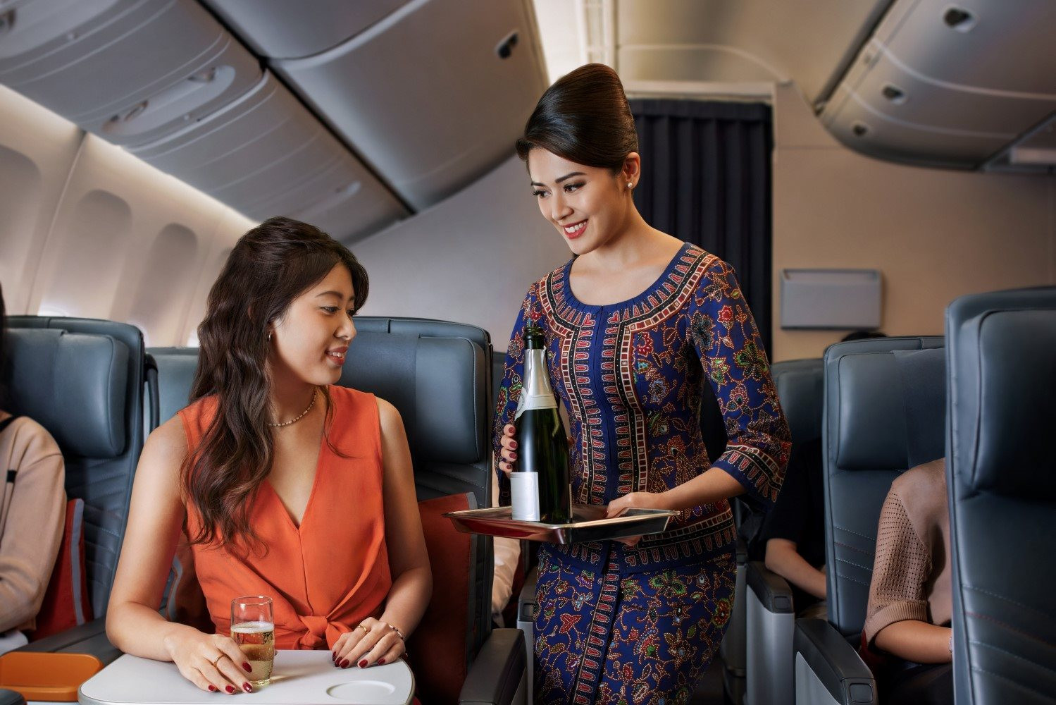 premium-economy_serving_champagne-custom.jpg