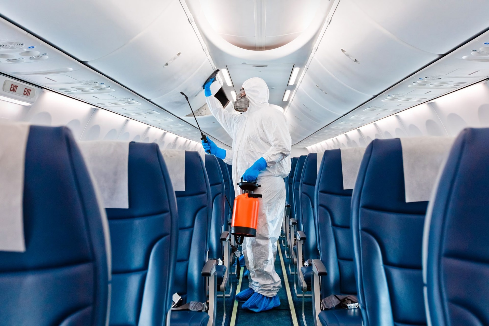 men-in-protective-suits-and-masks-disinfecting-airplane-gettyimages-1255018378_ksedit.jpg