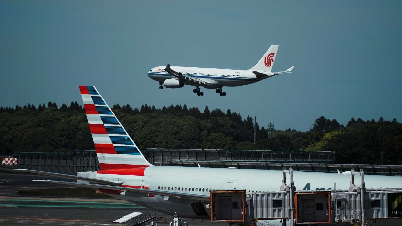 air-china-airbus-a330-landing-with-an-american-airlines-aircraft-in-the-foreground-shutterstock_2417007465.jpg