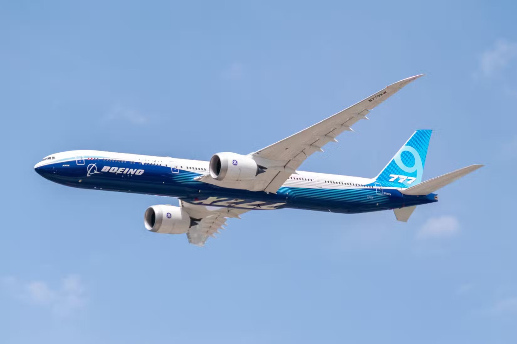 boeing-777x-flying-by-tom-boon-simple-flying.jpg