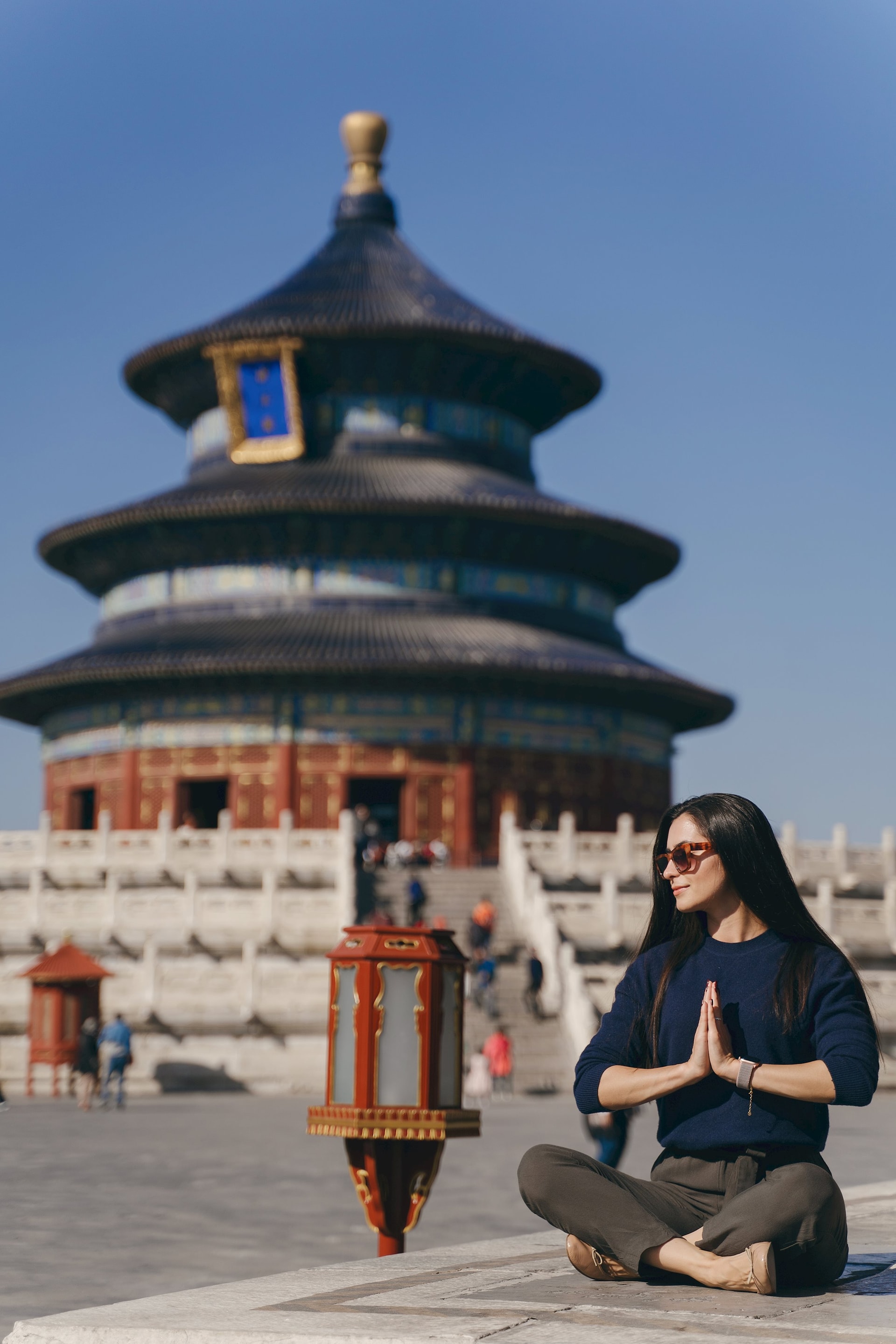 brunette-girl-sitting-steps-by-temple-heven-china.jpg