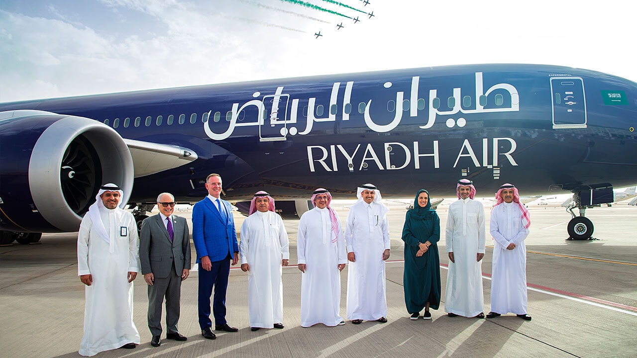 ceo in front of plane