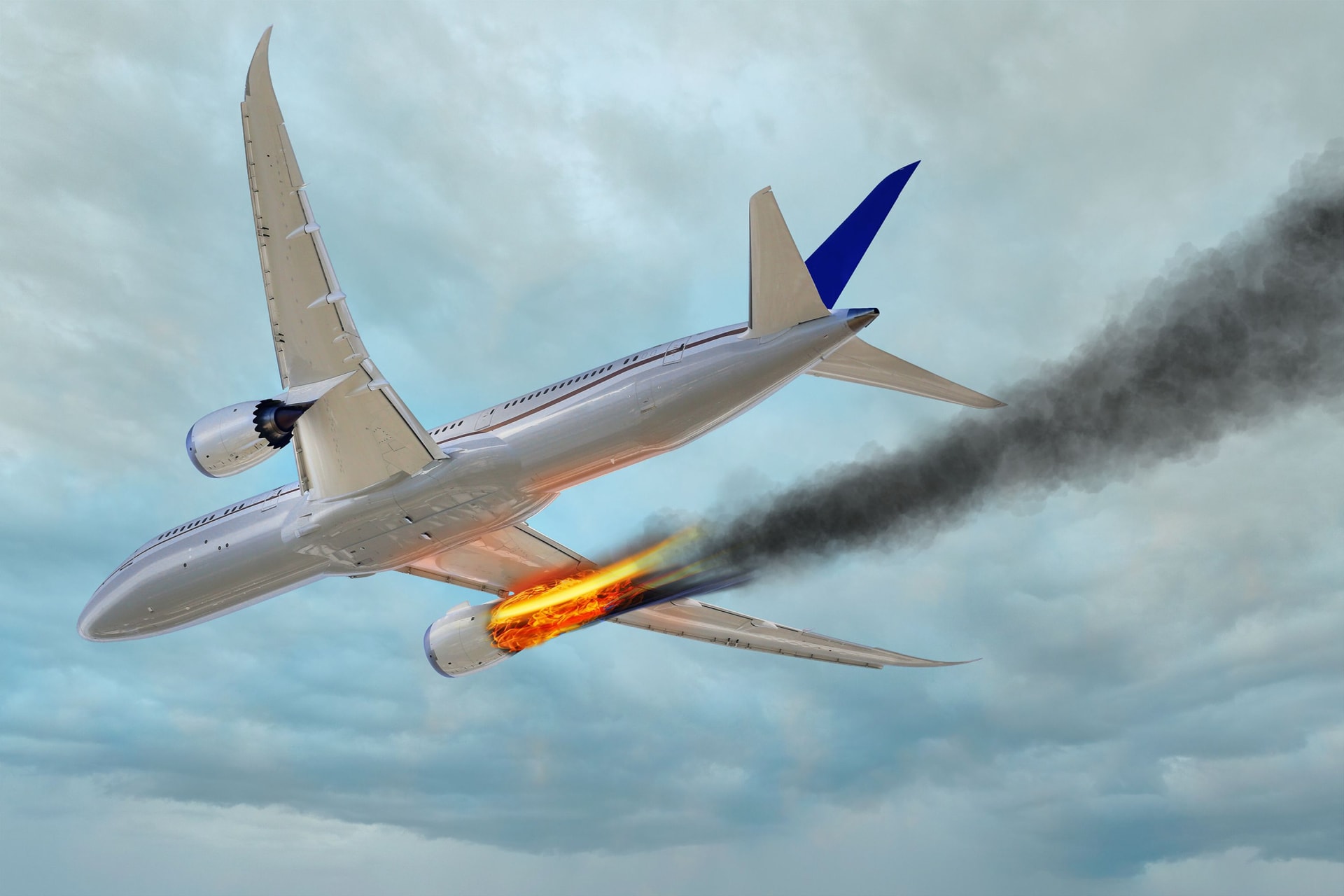 airplane-flying-in-the-sky-with-an-engine-on-fire-mayday-danger.jpg