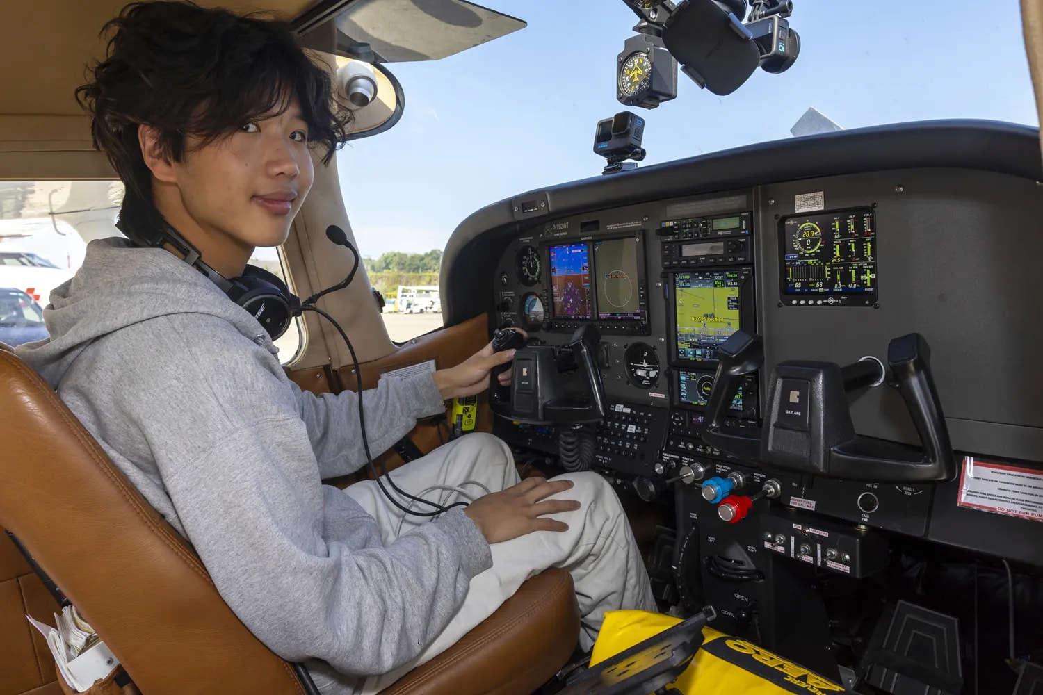 Ethan Guo poses for the photographer in Geneva, Switzerland, Tuesday, Aug. 6, 2024, before his take off from Geneva Airport for attempting a world record solo flight to all seven continents.