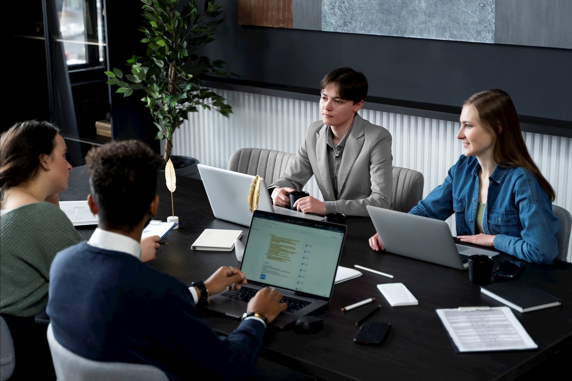 trans-person-working-office-with-colleagues.jpg