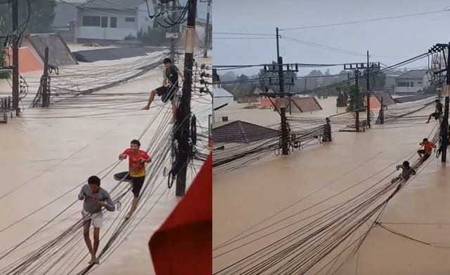 Lũ lịch sử ở Thái Lan: Người dân trèo cáp, phá mái nhà thoát hiểm - Ảnh 1.