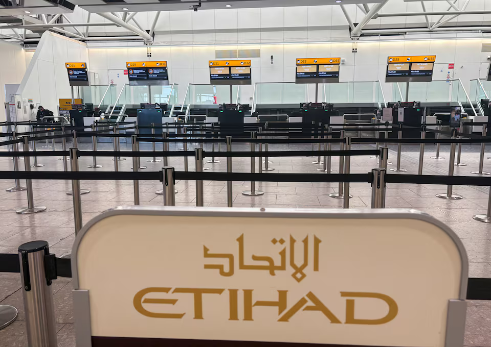 The Etihad airlines check in area remains closed amid the U.S.-Israel conflict with Iran, at Heathrow Airport Terminal 4, in Greater London