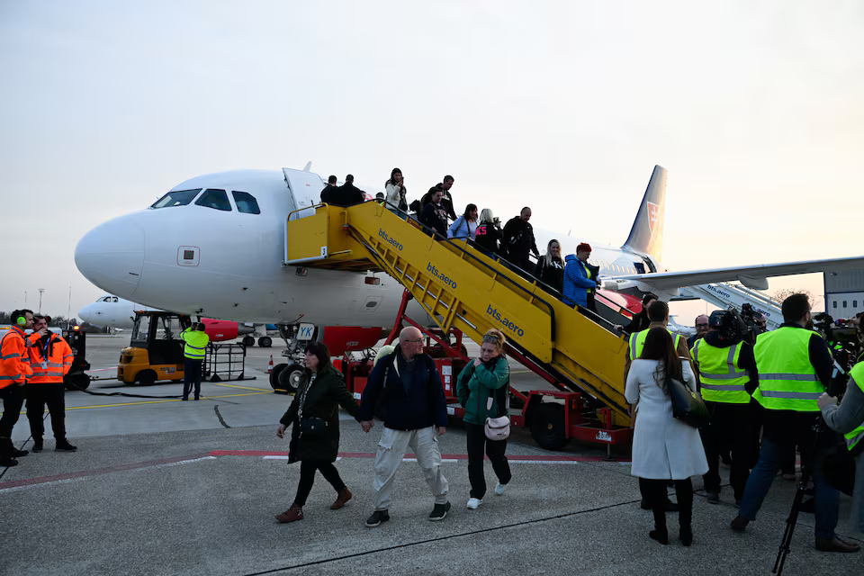 Repatriated Slovaks who were stranded in Jordan amid the U.S.-Israel conflict with Iran, arrive at M. R. Stefanik Airport, in Bratislava, Slovakia, March 3